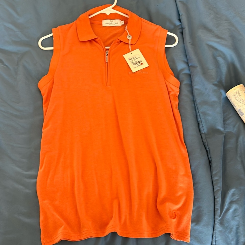 BUGATCHI …women’s orange sleeveless golf shirt…TPC Jasna Polana logo…size large